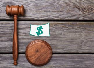 Evolution’s Pennsylvania studio hit with second fine Gavel and dollar sign representing fine