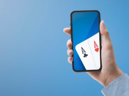 Mobile with playing cards represent a casino app