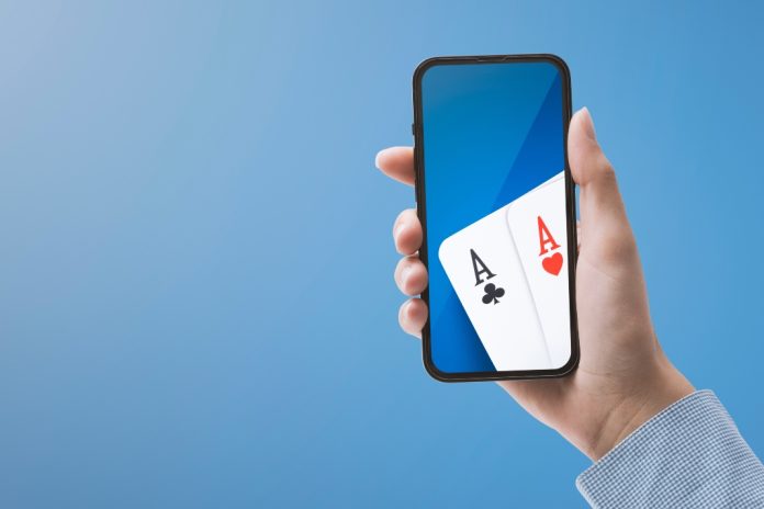 Mobile with playing cards represent a casino app