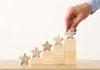EveryMatrix publishes record growth in full-year results Man placing stars on building blocks