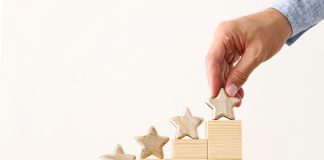 EveryMatrix publishes record growth in full-year results Man placing stars on building blocks