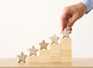 EveryMatrix publishes record growth in full-year results Man placing stars on building blocks