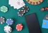 SYNOT Group calls on Playtech for Czech live casino studio Playing cards, poker chips and a mobile phone on a casino table