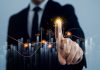YOLO praises Bitblox’s innovation amidst investment move Businessman pointing at graph going up