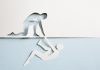 iGaming Daily: A journey from addiction to safer gambling advocacy A man cut out of paper being helped by the cut out of a man made of paper