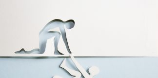 iGaming Daily: A journey from addiction to safer gambling advocacy A man cut out of paper being helped by the cut out of a man made of paper