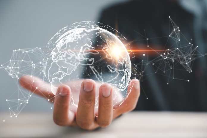 Global business Hand holding a digital globe
