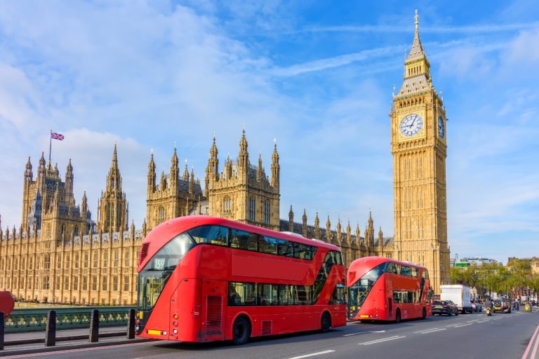Red london in the foreground and big ben in the background