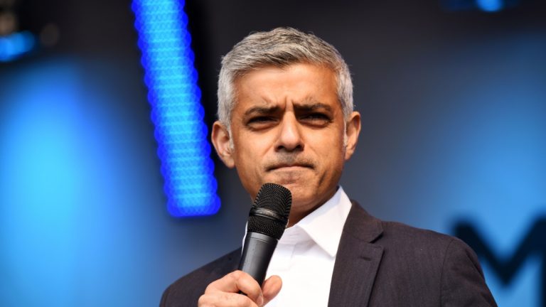 Sadiq Khan holding a microphone