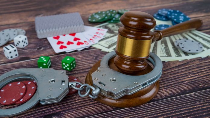 Aus illegal casino raids Handcuffs around poker chips