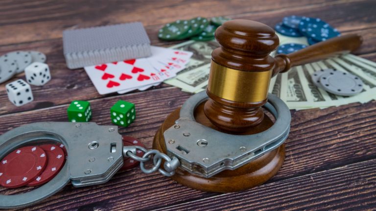 Rising illegal casino raids heighten Australia’s black market concerns Handcuffs around poker chips