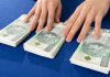 Stake set for another legal battle over sweepstake operations Piles of cash on a table