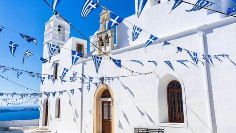House with Greek flag bunting