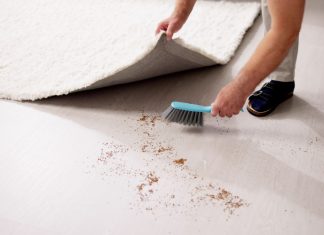 Regulatory Rundown: Sweepsing it under the carpet Man sweeping dirt under a rug