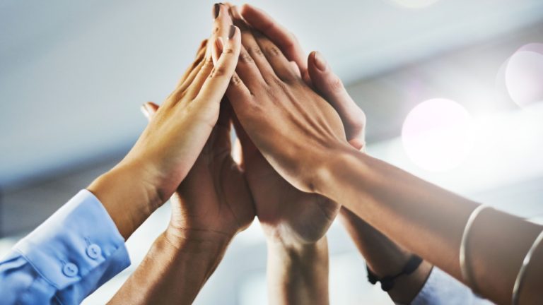 High 5 committed to “cooperation and transparency” in unlicensed casino probe Hands raised together