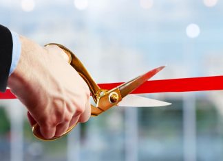 iGamingNuts.com unveils new affiliate site Businessman cuts ribbon