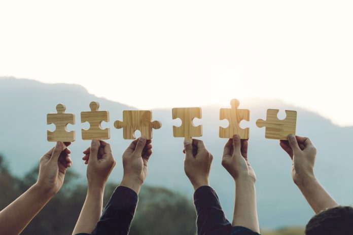 Concept,Of,Teamwork,And,Partnership.,Business,Teamwork,Joins,Puzzle,Pieces Partnerhips