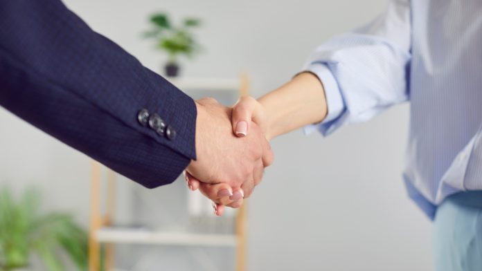 Two businessmen shake hands as Bjorn Sjoberg joins EveryMatrix