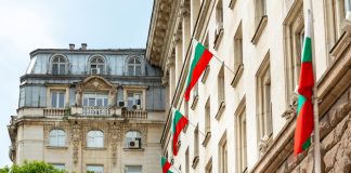 Bulgaria hopes to weaken black market with eurozone accession Bulgaria flags on the outside of a building