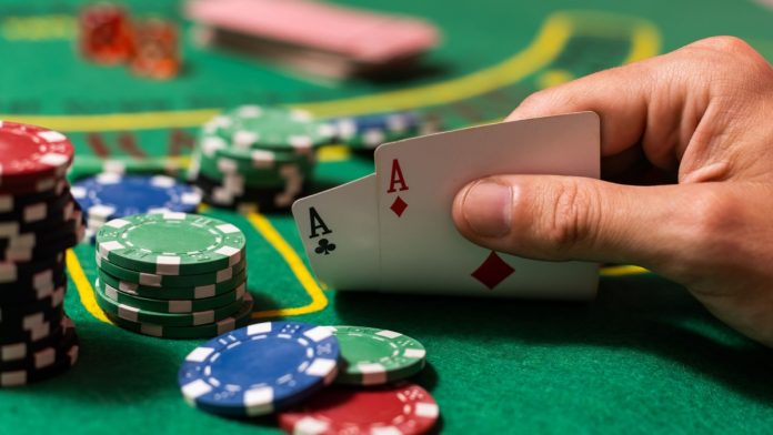 PA online poker pact Player looking at his hand