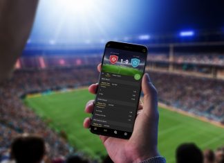 Sports betting a shrewd long-term investment for online casino operators Man looks at sports betting app