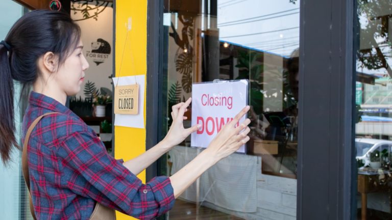 XLMedia proposes £11m tender for shareholders ahead of shutdown Women putting closing down sign on window