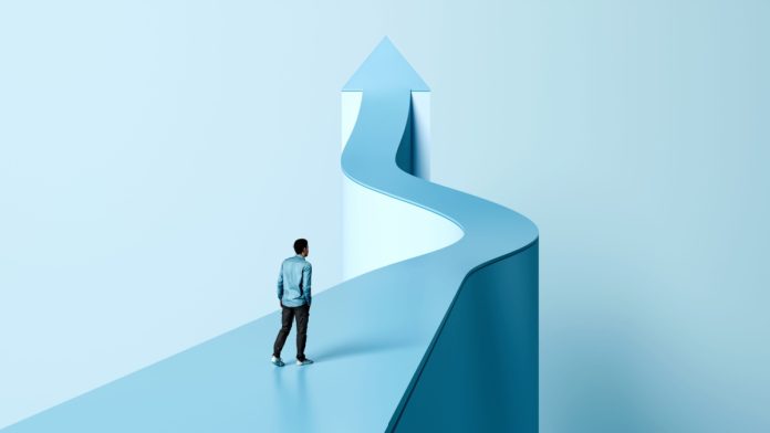 GR8 Tech Man looking up winding path