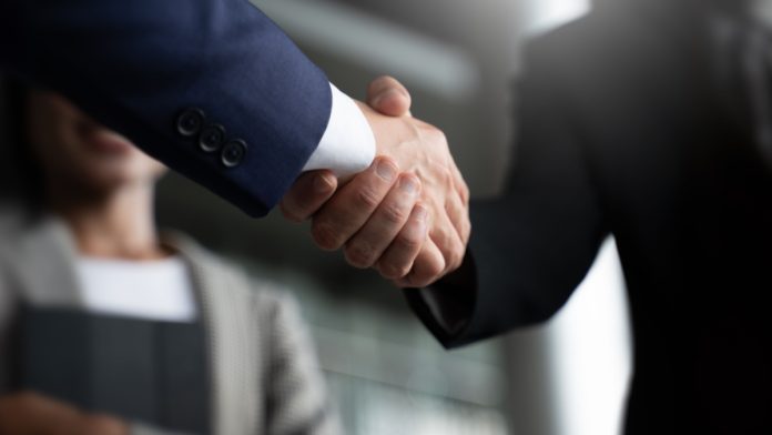 Strive Gaming x Delta Bingo Businessmen shaking hands
