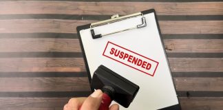Brazil regulator suspends four licenses for ordinance failings Red suspended stamp