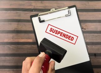 Brazil regulator suspends four licenses for ordinance failings Red suspended stamp