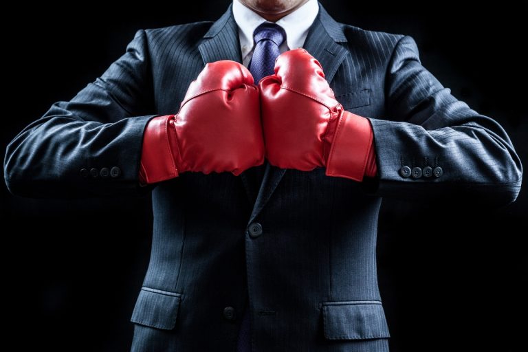 Businessman with boxing gloves as Codere Online will fight its delisting from the Nasdaq Stock Market
