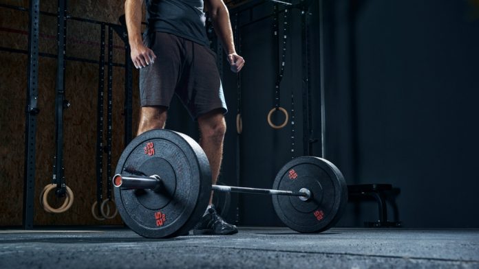 Man deadlifts