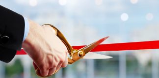 EveryMatrix unveils EngageSuite ecosystem A businessman cuts a red ribbon, opening a new product