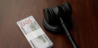 High 5 Games’ Connecticut licence reinstated following $1.5m settlement A gavel sits next to a stack of bank notes, indicating a settlement has been reached
