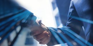 Croatia’s state lottery inks Greentube partnership Two businessman shake hands