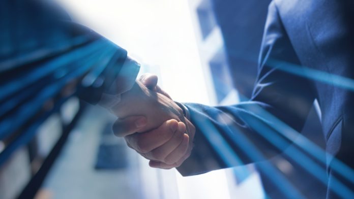 Two businessman shake hands