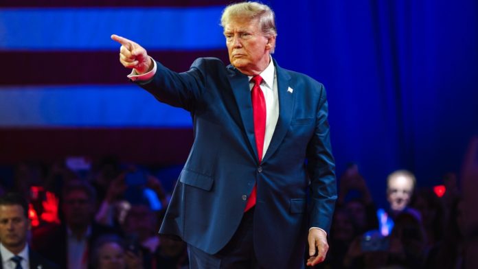 light-wonder-trump-tariff-chaos Donald Trump, the man behind the tariff chaos, points into the distance at an event