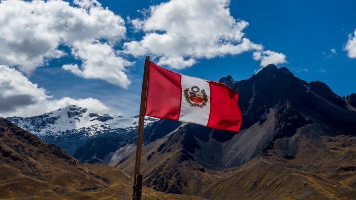 Peru flag with a mountain panorama