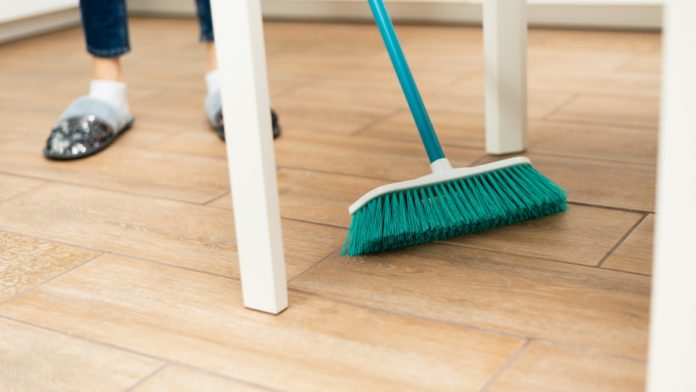 playn-go-ceo-sweepstakes-vow Women uses sweeping brush under table