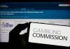 UKGC reveals gambling engagement data amidst financial profiling reform Gambling Commission logo on a phone, the body behind the gambling engagement data