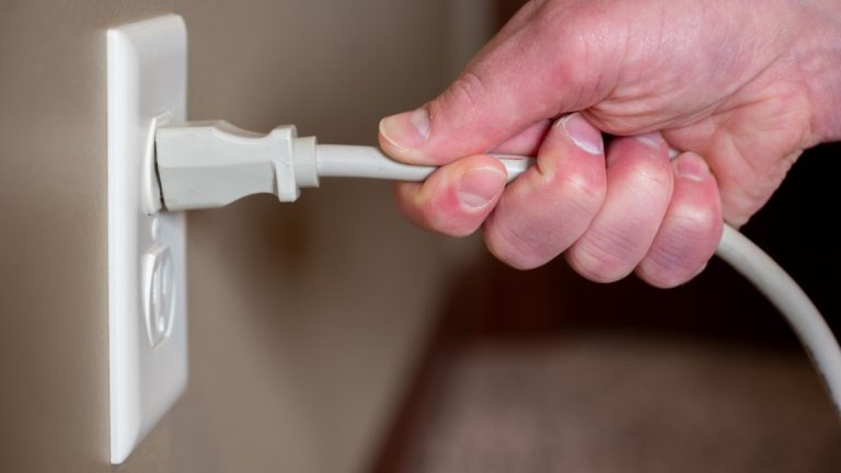 Wynn Resorts pulls the plug on New York casino plans Person begins to pull a cable from the plug