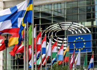 EU calls for digital well-being focus to combat teen gambling crisis The Eu flag alongside the flags of many countries across the continent