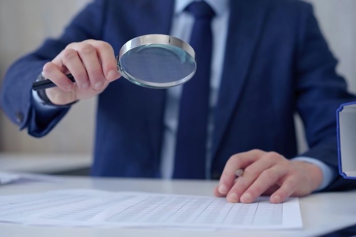 Swedish-gambling-regulator-undergoes-compliance-review-of-Svenska-Spel Businessman with magnifying glass as AB Trotting and Galloping, Svenska Spel Sport & Casino AB and Lotto Direct Limited will be checked for compliance by the Swedish regulator