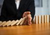 ACMA uncovers self-exclusion failures by four operators A hand stops dominos falling, just as the AMCA has intervened to stop more self exclusion failures