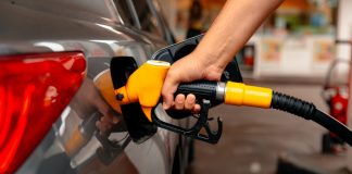 Belgian rule change fuels black market participation Close up of a person putting fuel in a car
