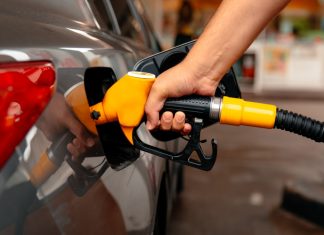 Belgian rule change fuels black market participation Close up of a person putting fuel in a car