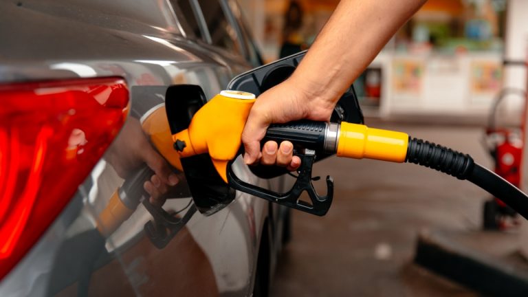 Belgian rule change fuels black market participation Close up of a person putting fuel in a car