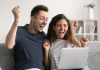 Blixx Gaming launches jackpot experience using FlowsPlay A couple celebrate a jackpot win on a laptop