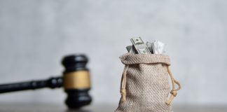 Casino Days hit with AGCO penalty for ‘deceptive’ bonus offer A sack of money next to a gavel, indicating that a financial penalty has been handed out