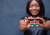 Kenya slashes betting excise duty to 5% Woman holds Kenya flag